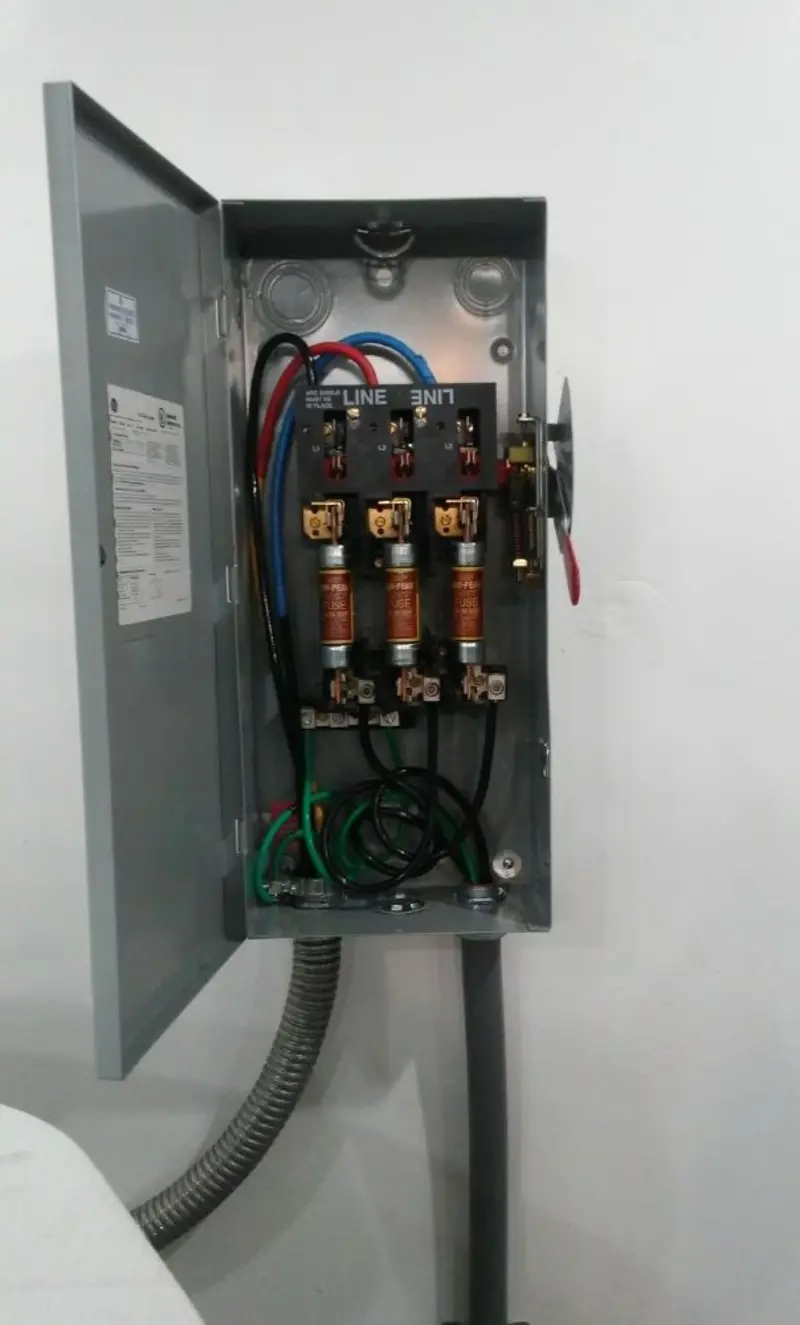 Three-phase disconnect switch installed for Smoke Detector Installation in Surfside